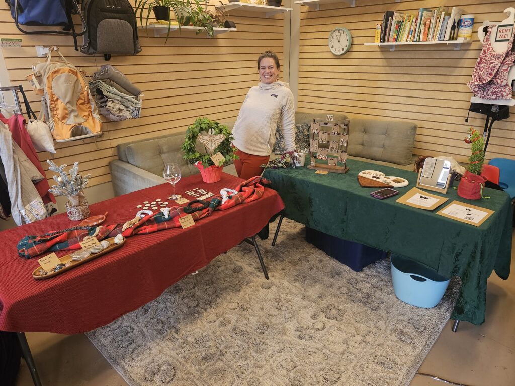 owner at a craft show smiling